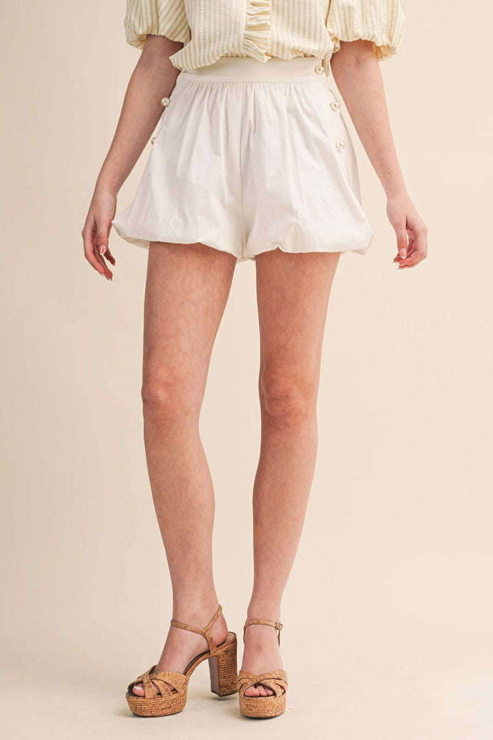 BUBBLE HEM SHORTS WITH PEARL BUTTONS
