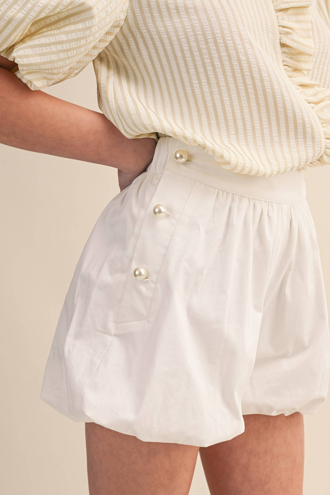 BUBBLE HEM SHORTS WITH PEARL BUTTONS