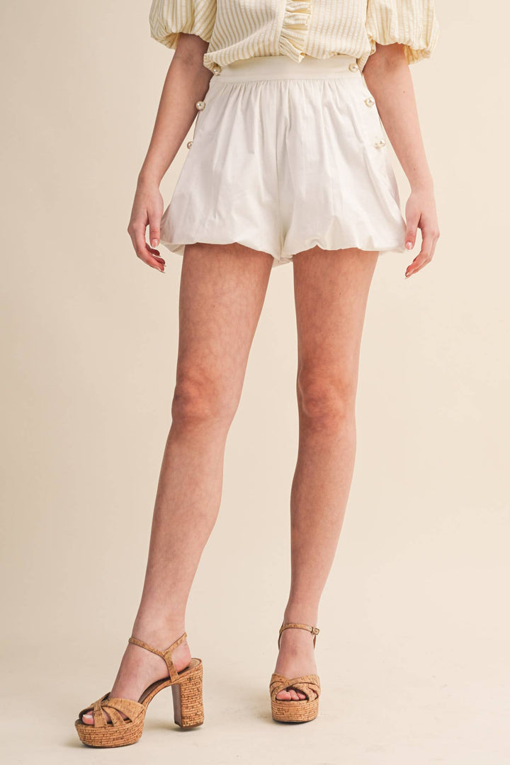 BUBBLE HEM SHORTS WITH PEARL BUTTONS