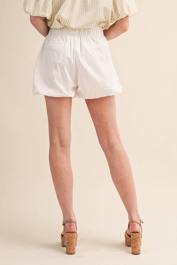 BUBBLE HEM SHORTS WITH PEARL BUTTONS